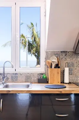 a bathroom with a shower and a sink and a mirror at Casa das Eiras, Nº48 in Santana