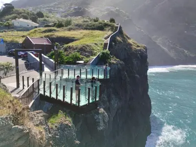 a viewing platform at the top of a mountain at sunset at Casa das Eiras, Nº48 in Santana