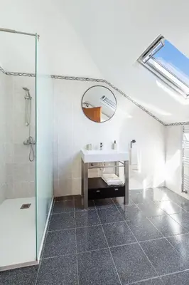 a kitchen with a sink and two windows at Casa das Eiras, Nº48 in Santana