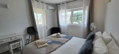 a bedroom with a bed with two towels on it at Apartamento Cristino in Luz