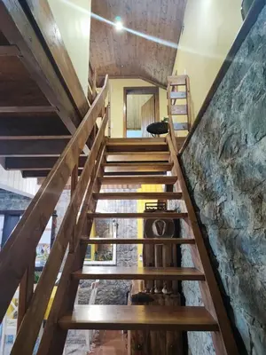 a staircase leading up to the second floor of a house at Quinta Meneses in Santa Cruz