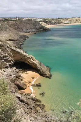 an aerial view of a beach with blue water at Blue Room in Pedralva