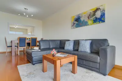 a living room with a couch and a table at Sunset Horizon by Atlantic Holiday in Estreito de Câmara de Lobos