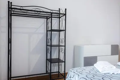 a black metal bunk bed in a bedroom at GuestReady - Paradisus Residence Atlantic Retreat in Caniço