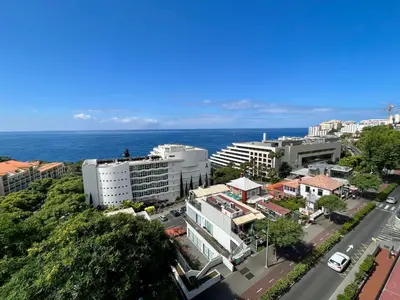an aerial view of a city with the ocean at Lido Sol 318 in Funchal