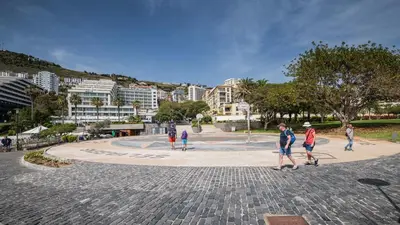 a group of people walking around a park at Lido Sol 318 in Funchal