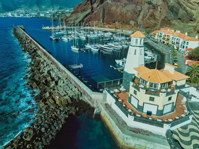 an aerial view of a resort by the water at Dreams Madeira Resort Spa & Marina in Caniçal