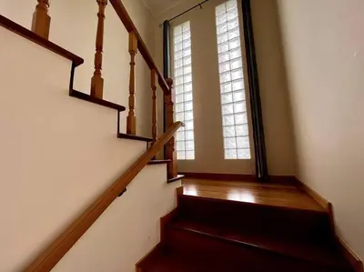 a staircase in a house with a window at Casa Darcey by Your Madeira Rentals in Estreito da Calheta