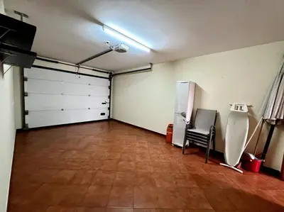 a large room with a garage with a wooden floor at Casa Darcey by Your Madeira Rentals in Estreito da Calheta