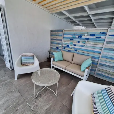 a living room with a couch and a table at ALDABRA - CASA VACANZE EM PORTO SANTO in Porto Santo