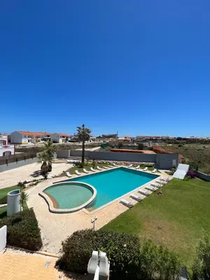 a swimming pool on the roof of a building at Retiro do Sossego in Sagres
