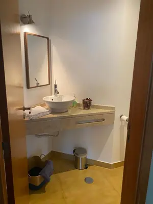 a bathroom with a sink and a mirror at Casa dos Arrifes - Villa with Ocean view and private Garden in Funchal