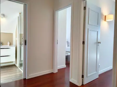 an empty room with a mirror and a bathroom at Holiday`s House 