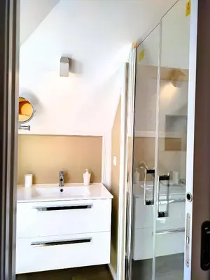 a bathroom with a sink and a shower at Holiday`s House 