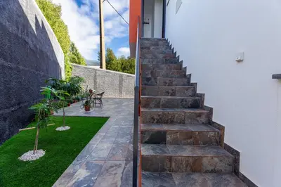 a set of stairs leading up to a building at Casa Teixeira by Atlantic Holiday in Venda do Atalhinho