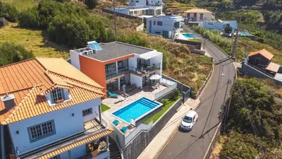 an aerial view of a house with a swimming pool at Casa Teixeira by Atlantic Holiday in Venda do Atalhinho