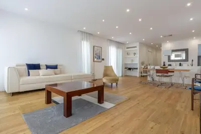 a living room with a couch and a table at Villa Mármore in Funchal