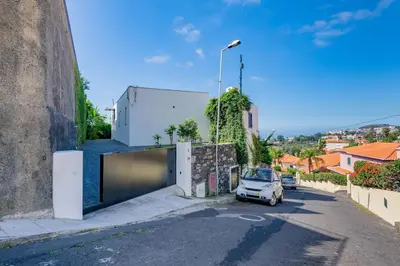a small car parked on the side of a street at Villa Mármore in Funchal