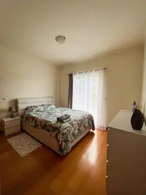 a bedroom with a bed and a window at Ina's Garden in Santa Cruz in Santa Cruz