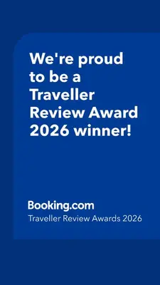 a blue sign that says were proud to be a traveller reviewagency winner at Casa Mar Adentro in Câmara de Lobos