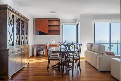 a kitchen and dining room with a table and chairs at Blue and Gold Sunset by Homie in Funchal