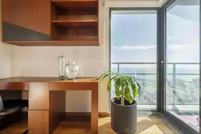 a kitchen with a desk and a plant next to a window at Blue and Gold Sunset by Homie in Funchal