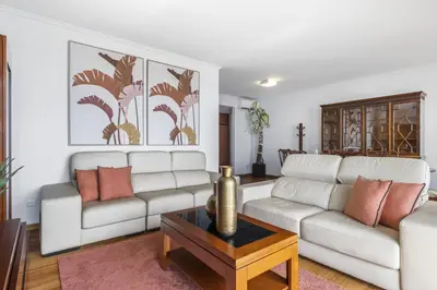 a living room with two white couches and a coffee table at Blue and Gold Sunset by Homie in Funchal