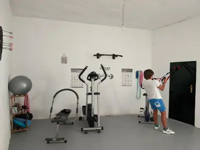 a woman working out in a gym at Casa Ascenção, vista mar Madeira in Funchal