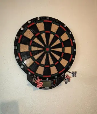 a dartboard hanging on a wall at Casa Ascenção, vista mar Madeira in Funchal
