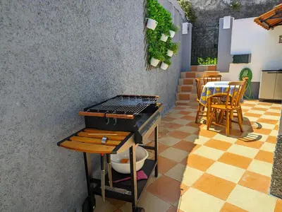 a rendering of a barbecue grill on a patio at Casa Ascenção, vista mar Madeira in Funchal