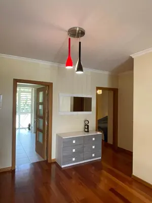 a living room with a dresser and a tv at Beach&Comfort Cozy Apartment by the Ocean in Funchal