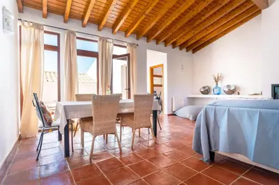 a dining room with a table and chairs at Casa Mira Vale - Calm Country House by Lisbeyond in Aljezur