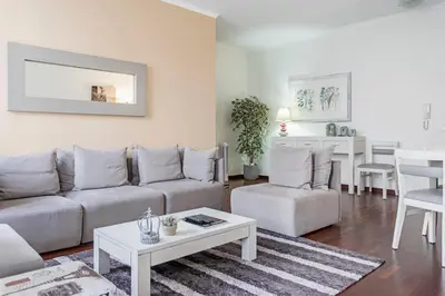 a living room with a couch and a table at Achada I by An Island Apart in Funchal