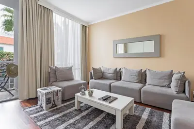 a living room with a couch and a table at Achada I by An Island Apart in Funchal
