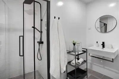 a bathroom with a shower and a sink at Babosas Charm in Funchal