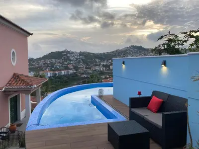 a view of a swimming pool from a house at Casa da Quinta in Funchal