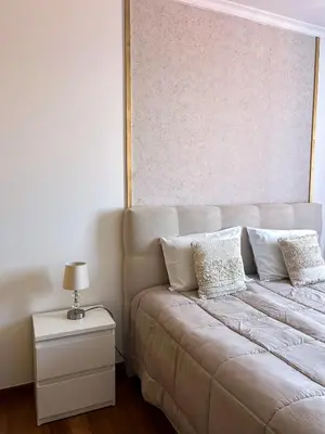 a bed with pillows on it in a room at The Pink Villa - Holidays in Madeira Island in Caniço