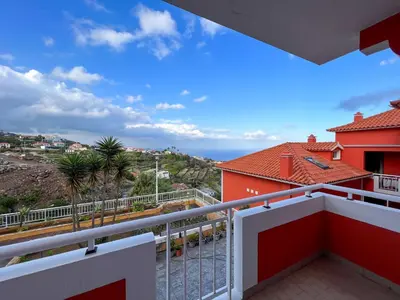 a balcony with a view of the ocean at The Pink Villa - Holidays in Madeira Island in Caniço