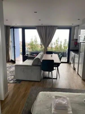 a living room with a couch and a table at Atlântico Azul in Funchal