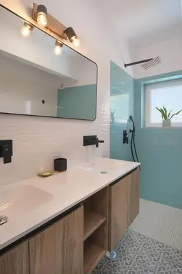 a bathroom with a sink and a mirror at Peaceful Ocean View Villa in Luz