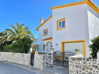 a white house with a gate and a fence at Peaceful Ocean View Villa in Luz