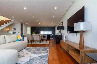 a living room with a couch and a table at Tiz house in Funchal