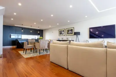 a living room with couches and a dining room at Tiz house in Funchal