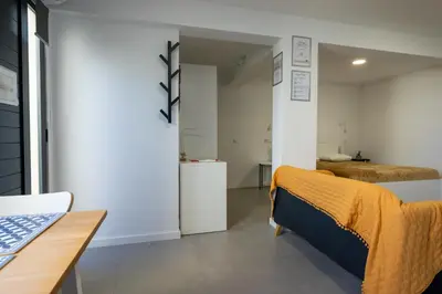 a living room with a couch and a table at Sun Hill Apartment in Santa Cruz