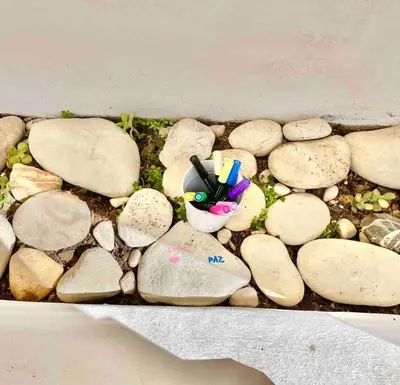 a bunch of rocks with a toy on top of it at Ocean Breeze & Sea Salt Apartment in Luz