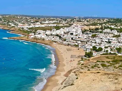 an aerial view of a beach with buildings and the ocean at Ocean Breeze & Sea Salt Apartment in Luz