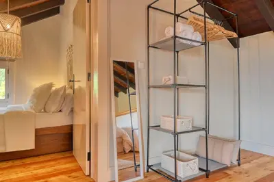 a glass shelf in a room with a bed at Chalet da Nogueira, a Home in Madeira in Ponta do Sol