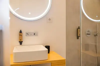 a bathroom with a sink and a shower at Casa Da Avó Clementina Nº 30 in Funchal