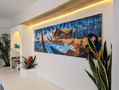 a painting hanging on a wall in a room at Casa KIWI 3 chambres et piscine in Luz