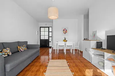 a living room with a gray couch and a table at Casa Yucca - Porto Santo Island in Porto Santo
